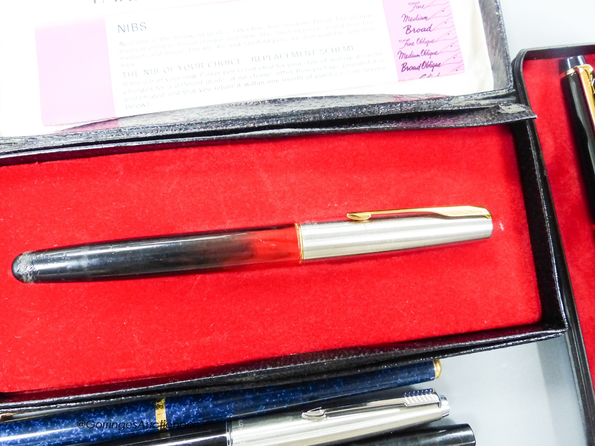 An assortment of fountain pens and ball point pens